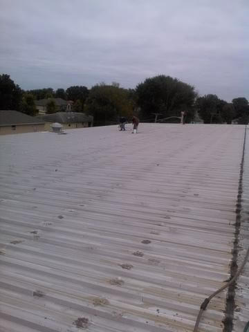 Exposed fastener metal roofing repair in Naperville IL After
